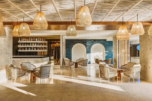 3 bars/lounges, poolside bar, beach bar