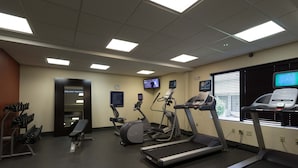 A gym with treadmills, elliptical machines, and free weights. - Hampton Inn Columbus-South (Grove City)