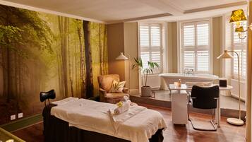Experience a serene retreat with a large bed, a cozy chair, and a warm ambiance.