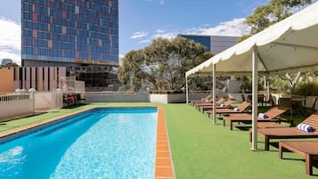 Outdoor pool, open 6:00 AM to 9:00 PM, sun loungers