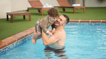Outdoor pool, open 6:00 AM to 9:00 PM, sun loungers