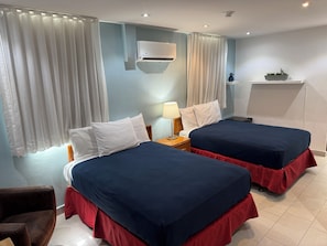 Standard Double Room, 2 Double Beds | In-room safe, individually decorated, desk, blackout drapes