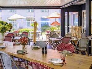 Lunch, dinner, brunch served; French cuisine, pool views 