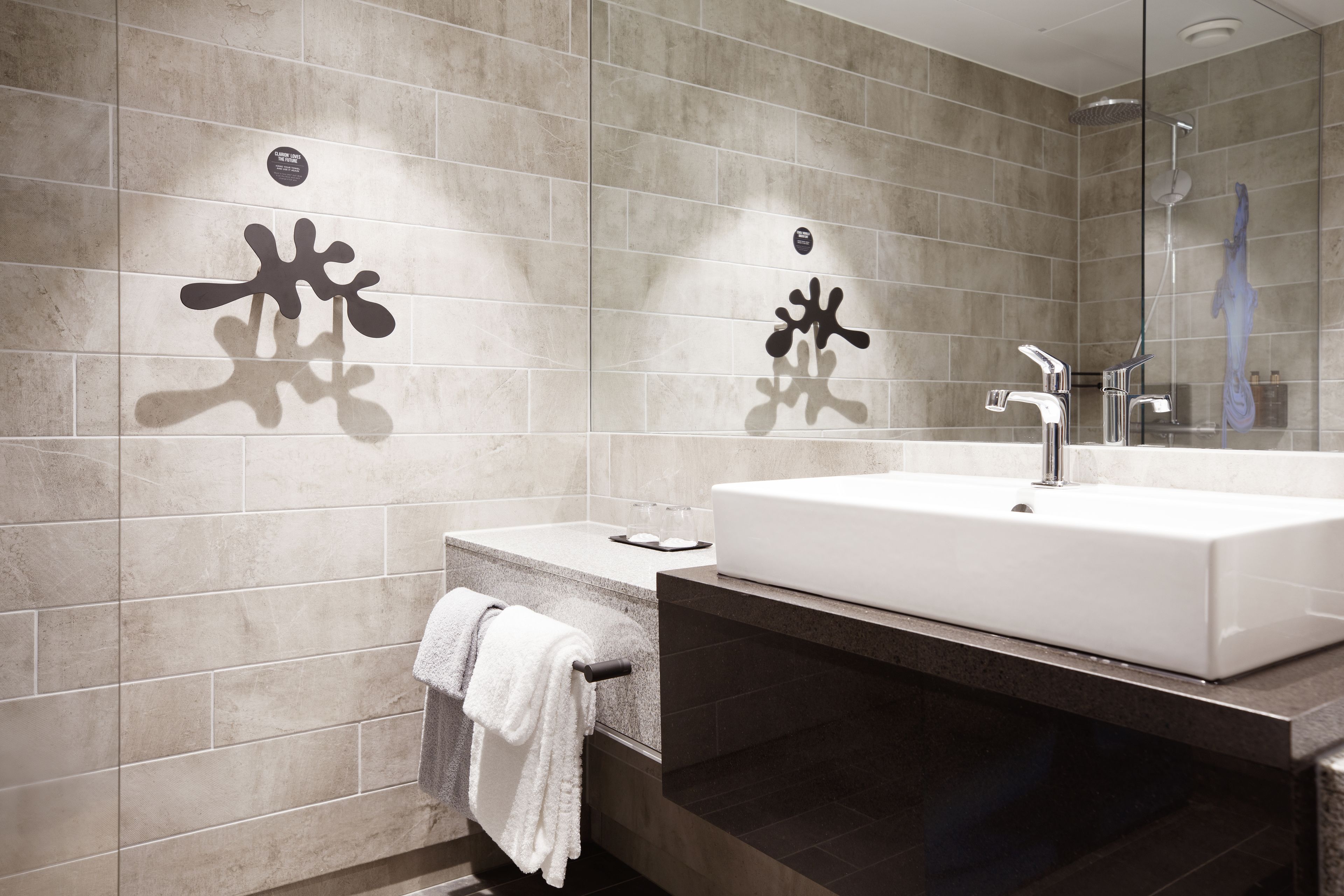 shower, rainfall showerhead, hair dryer, towels