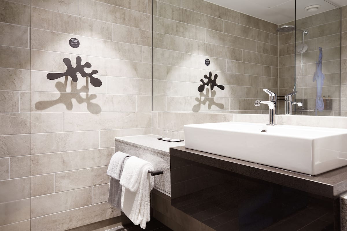 shower, rainfall showerhead, hair dryer, towels