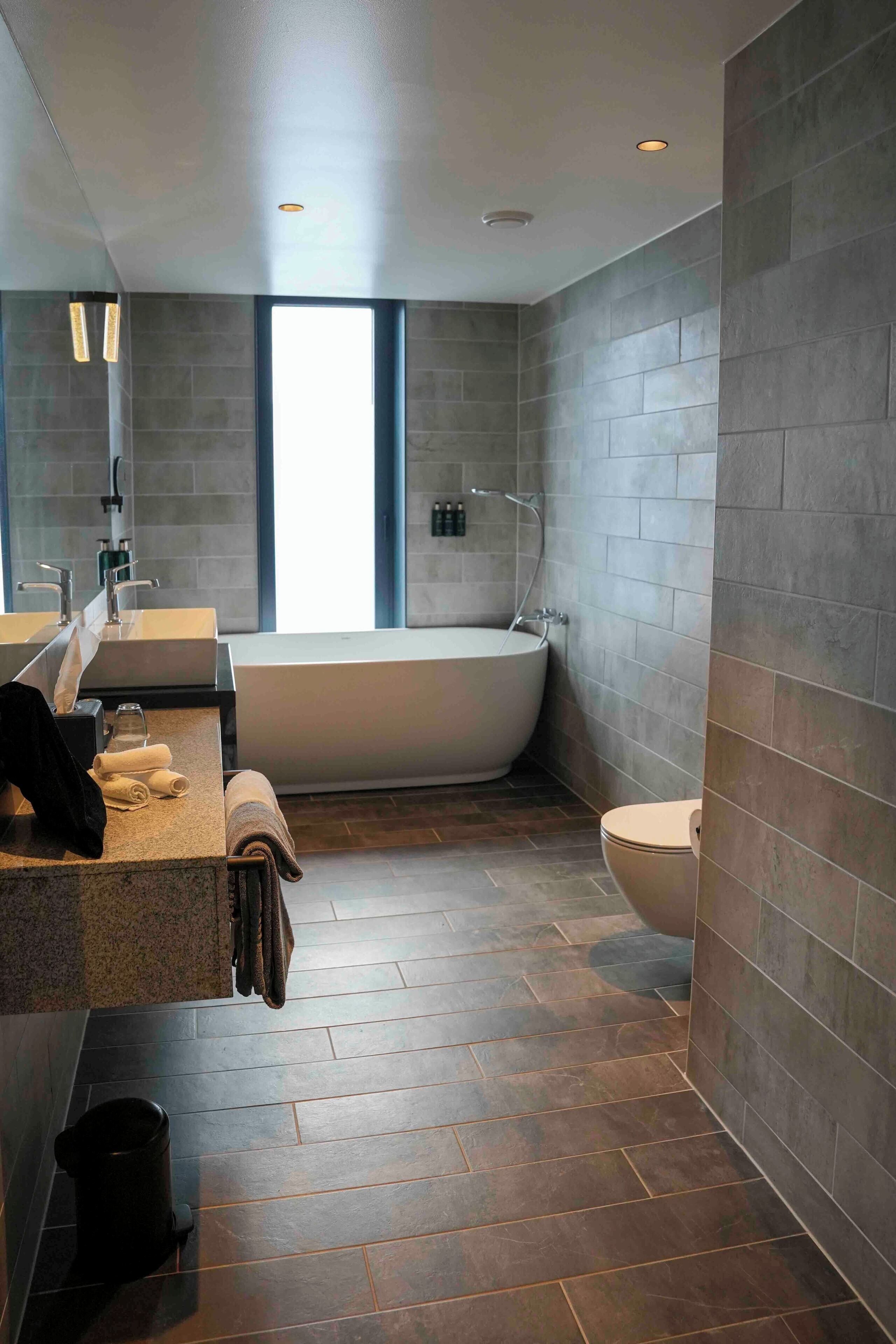 superior suite | bathroom | shower, rainfall showerhead, hair dryer, towels