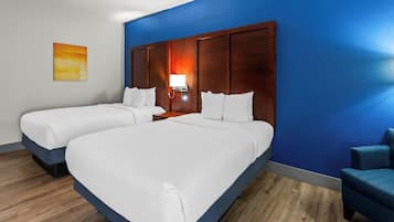 Premium bedding, memory-foam beds, desk, laptop workspace