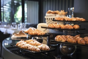 Indulge in a selection of freshly baked pastries and croissants.