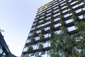 Enjoy stunning views from the spacious balconies, each adorned with lush greenery.