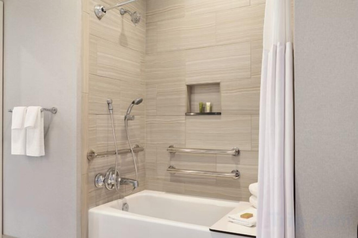Designer toiletries, hair dryer, towels