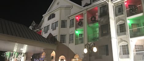 A multi-story hotel with a classic architectural style, featuring arched windows and balconies.