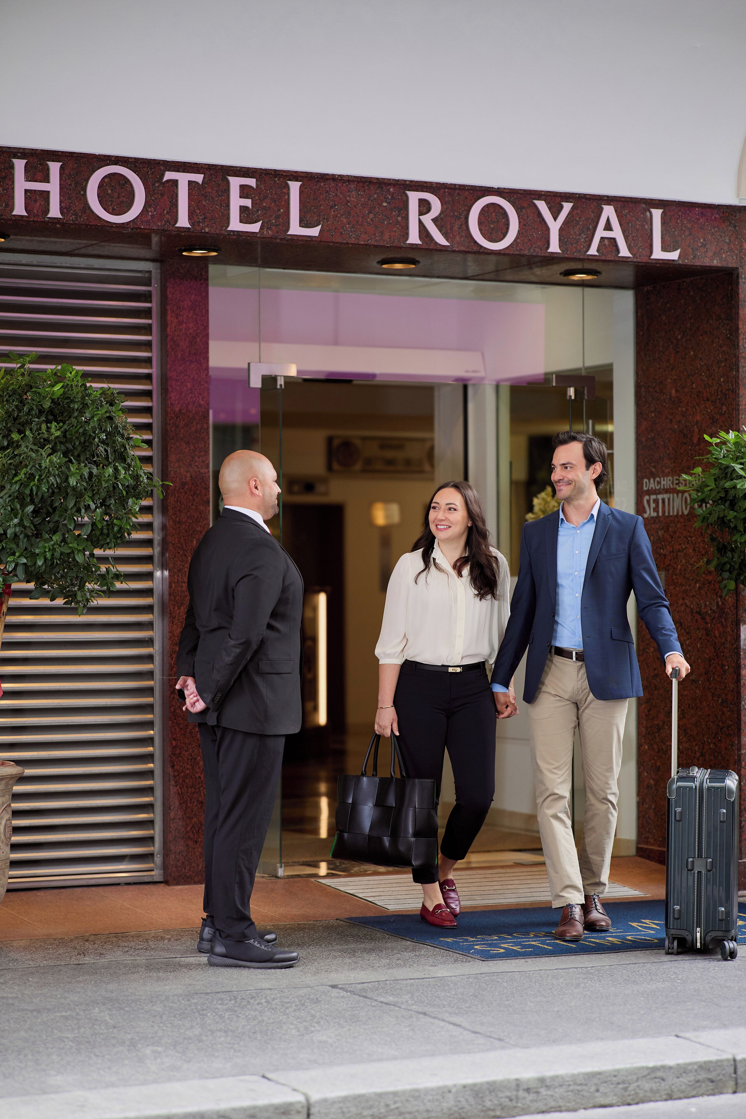 A hotel entrance with a sign reading "HOTEL ROYAL".