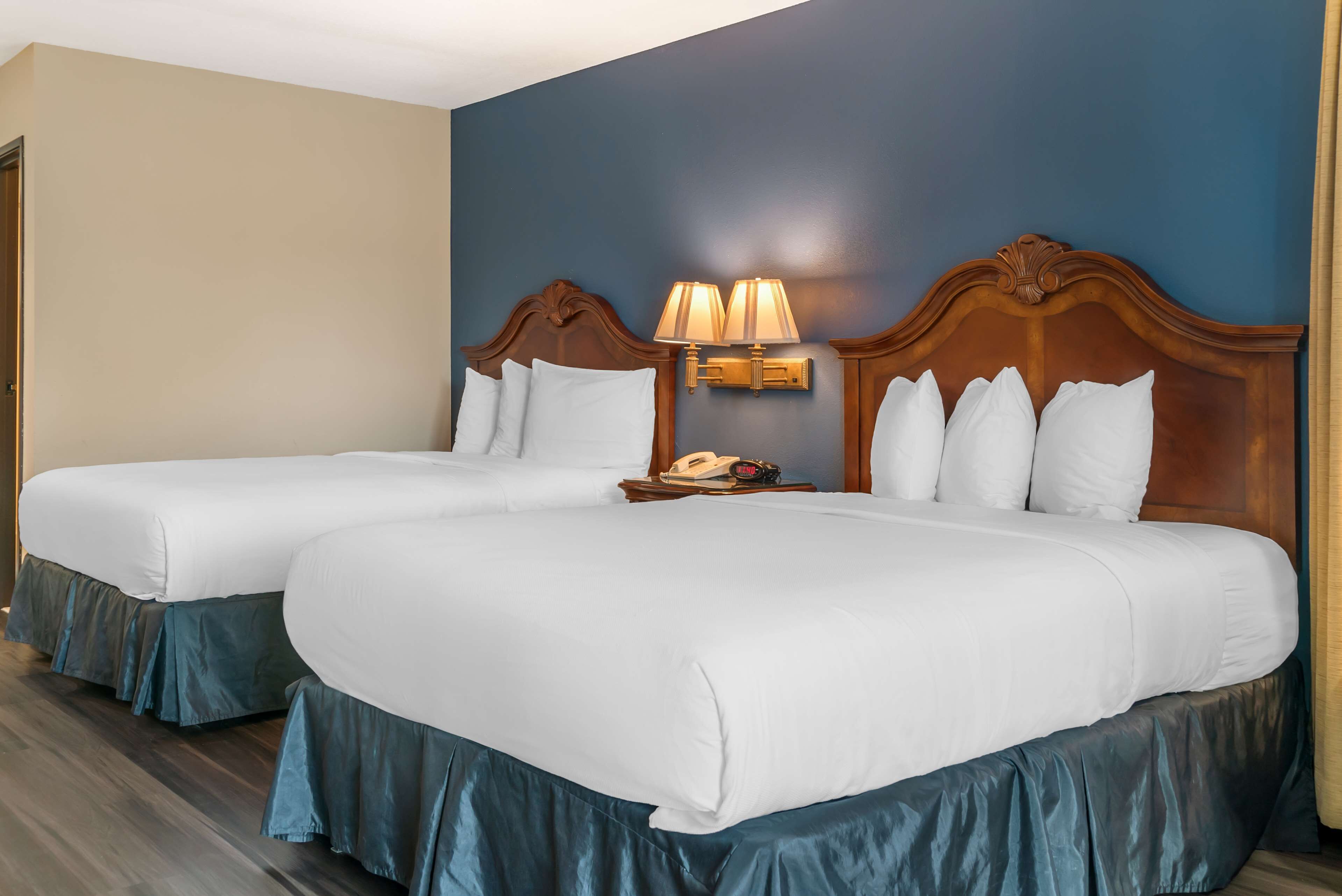 standard room, 2 queen beds, balcony, river view | iron/ironing board, bed sheets