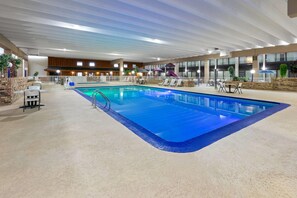 Indoor pool, open 9:00 AM to 10:00 PM, pool umbrellas, sun loungers - Ramada Hotel & Conference Center by Wyndham Grayling (Grayling)