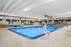 Indoor pool, open 9:00 AM to 10:00 PM, pool umbrellas, pool loungers