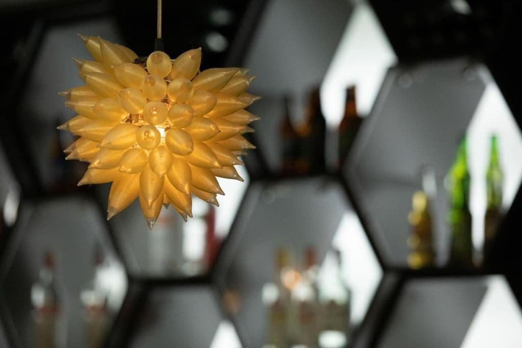 A hanging light fixture with a geometric design.