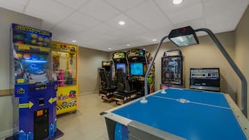 Enjoy games and friendly competition in our indoor recreational area, featuring a variety of gaming machines and a foosball table.