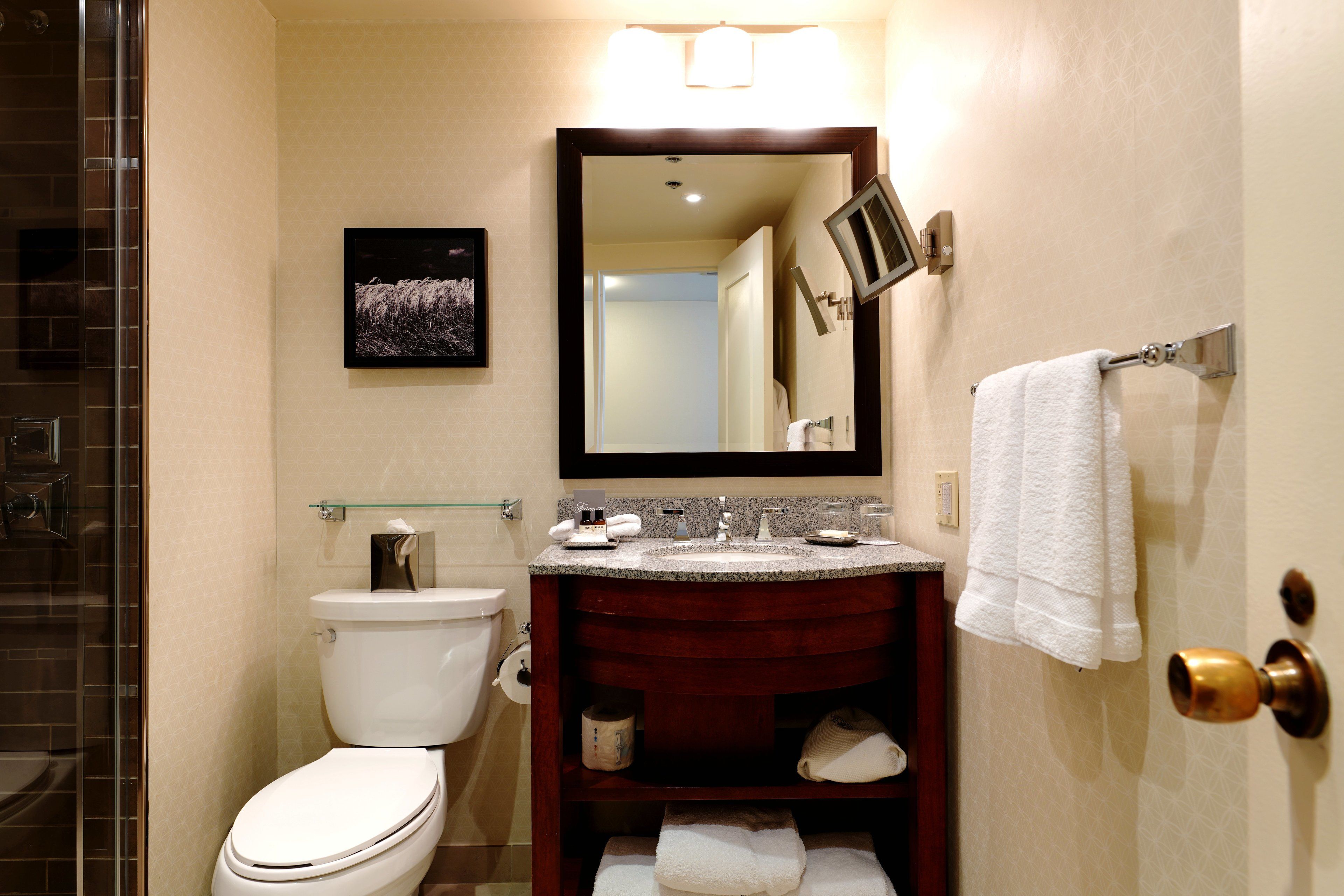 designer toiletries, hair dryer, towels