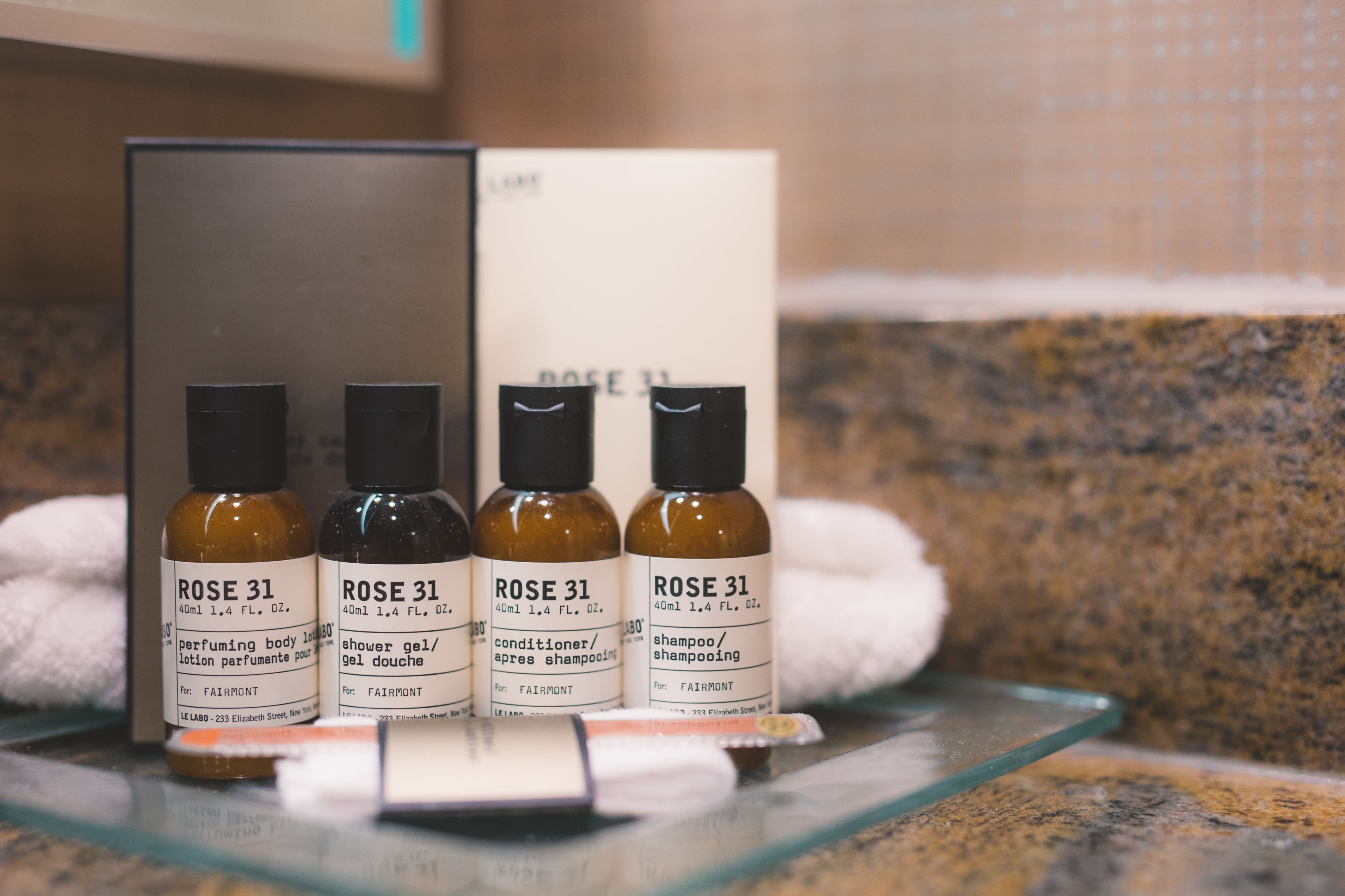 designer toiletries, hair dryer, towels