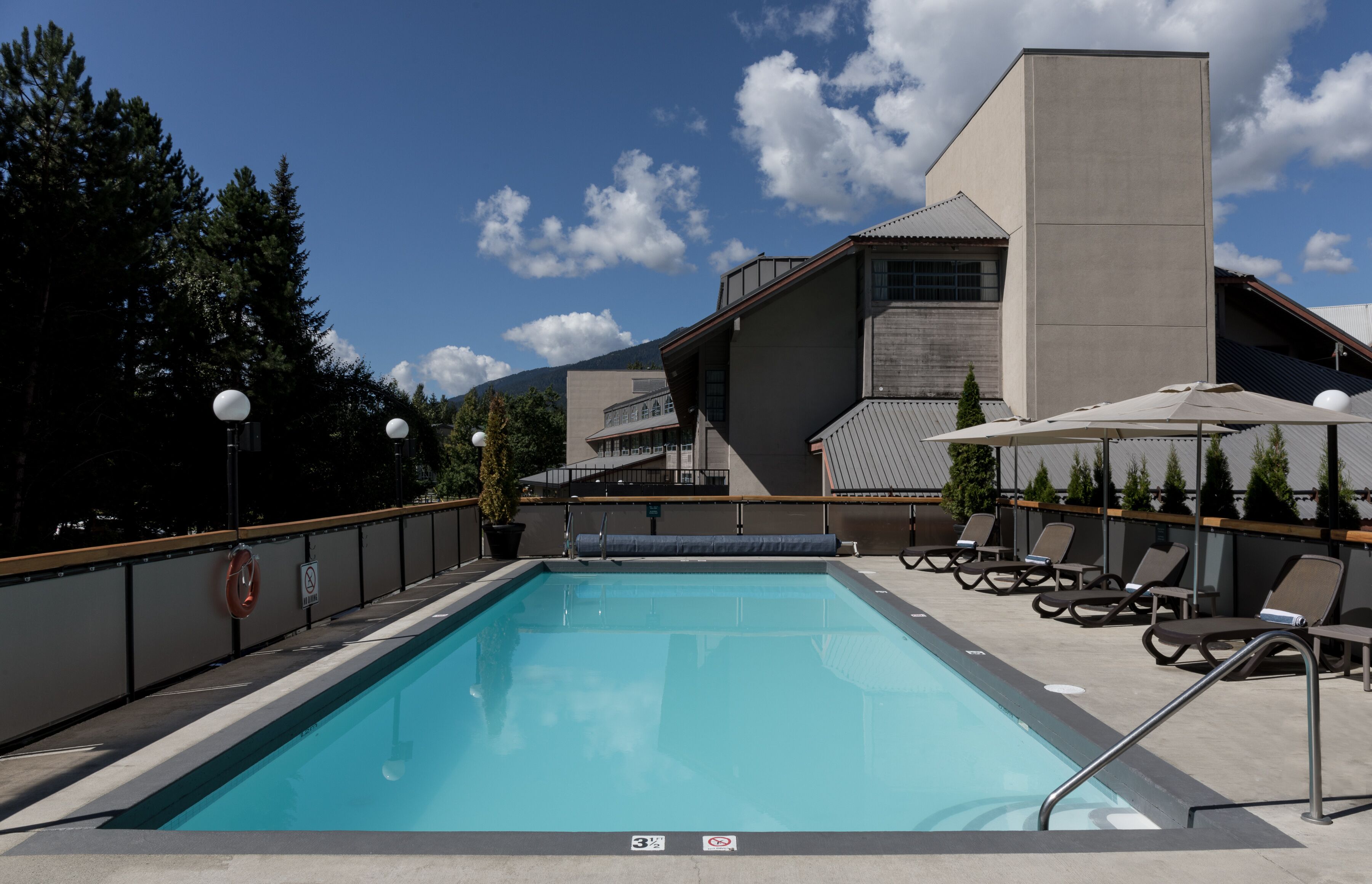 outdoor pool, a heated pool, pool loungers