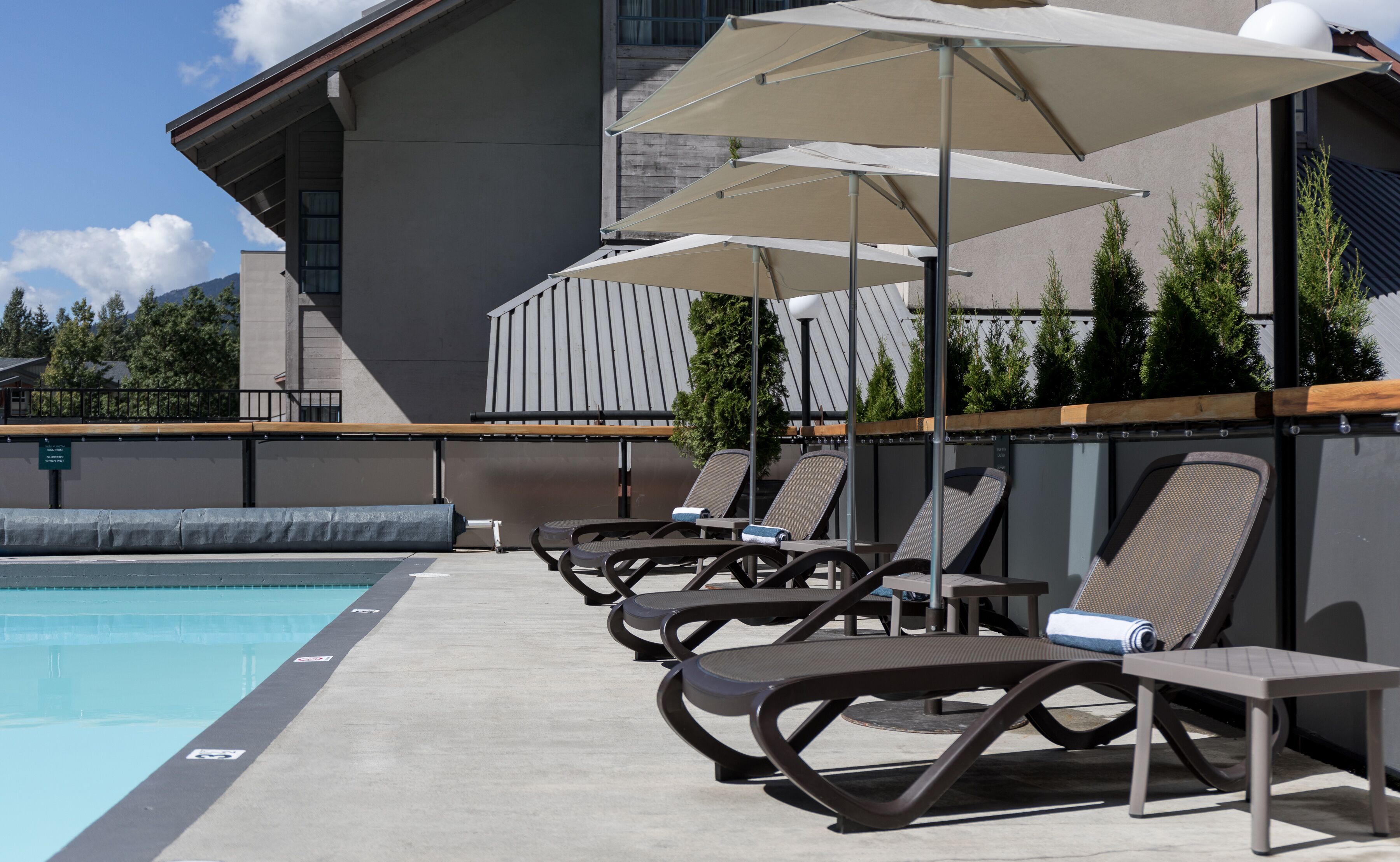 outdoor pool, a heated pool, pool loungers