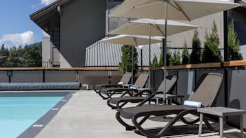Outdoor pool, a heated pool, sun loungers