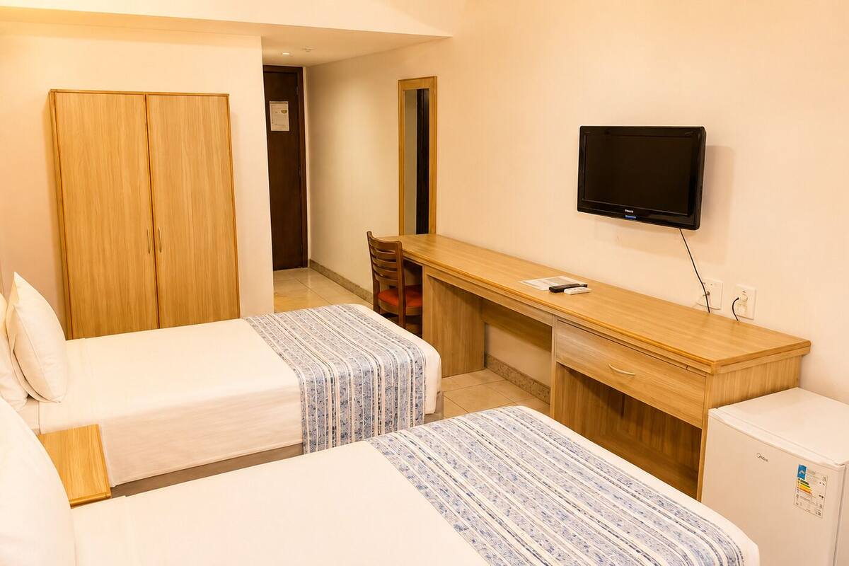 Twin kamer, 2 eenpersoonsbedden | Een minibar, een kluis op de kamer, gratis wifi, beddengoed