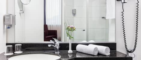 Shower, hair dryer, slippers, towels
