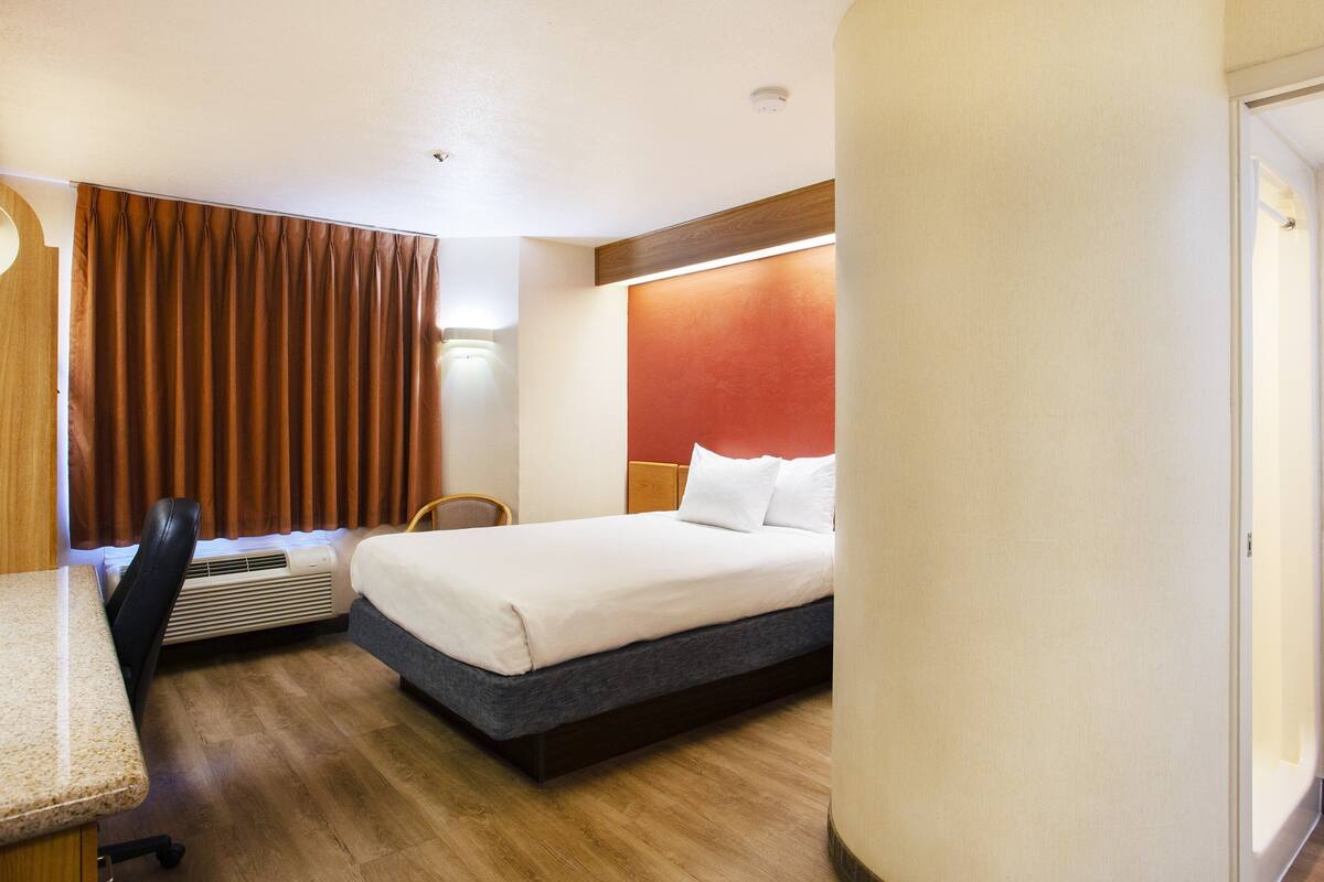 one queen bed, non-smoking | 1 bedroom, desk, laptop workspace, iron/ironing board