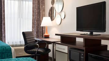 Desk, laptop workspace, blackout drapes, iron/ironing board