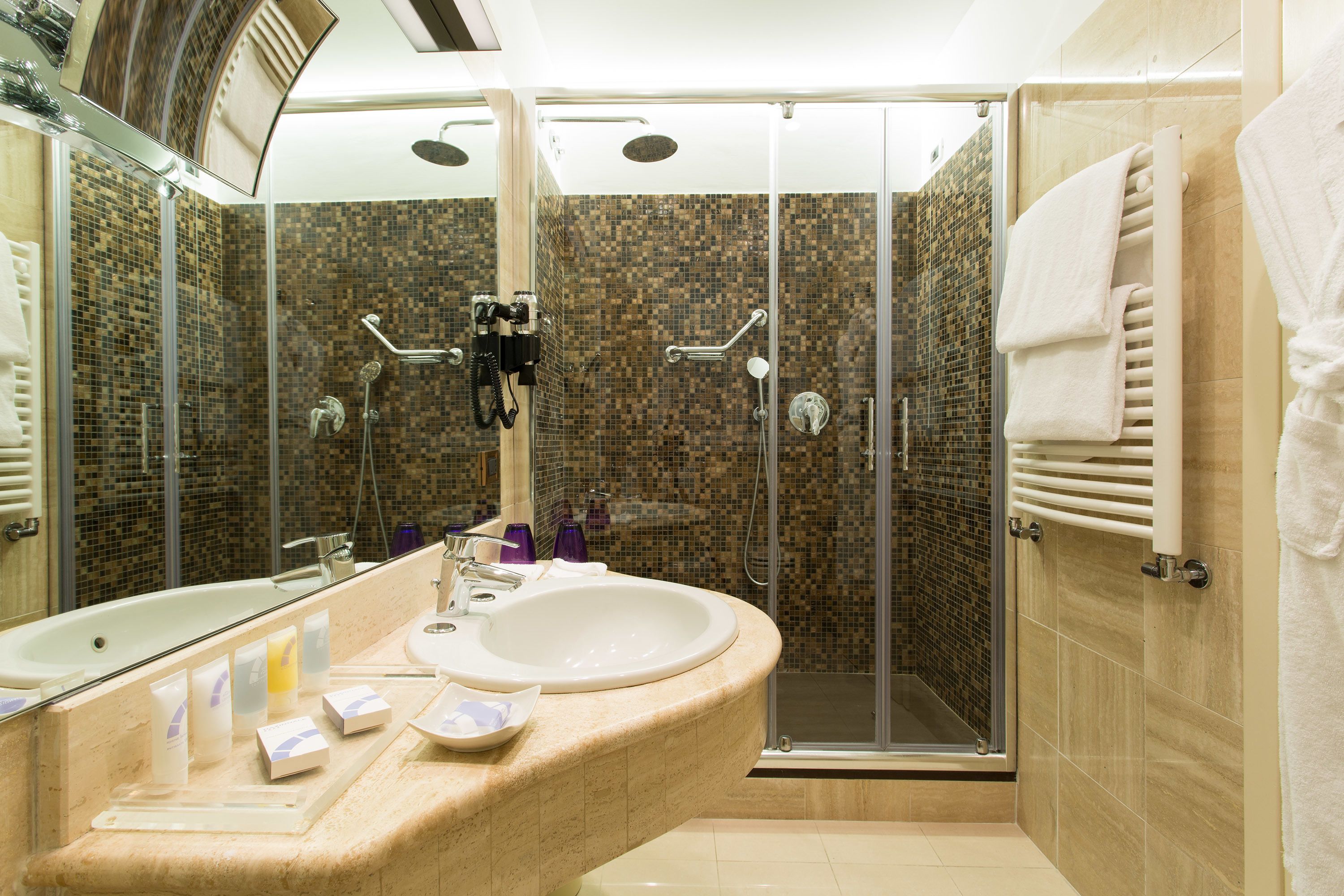 rainfall showerhead, eco-friendly toiletries, bidet, towels