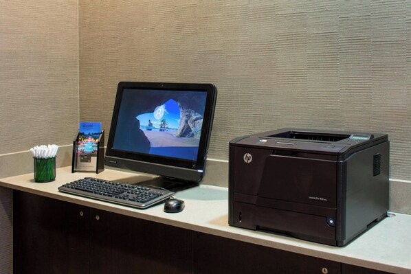 A desktop with a monitor, keyboard, mouse, and HP LaserJet Pro 4000 printer.