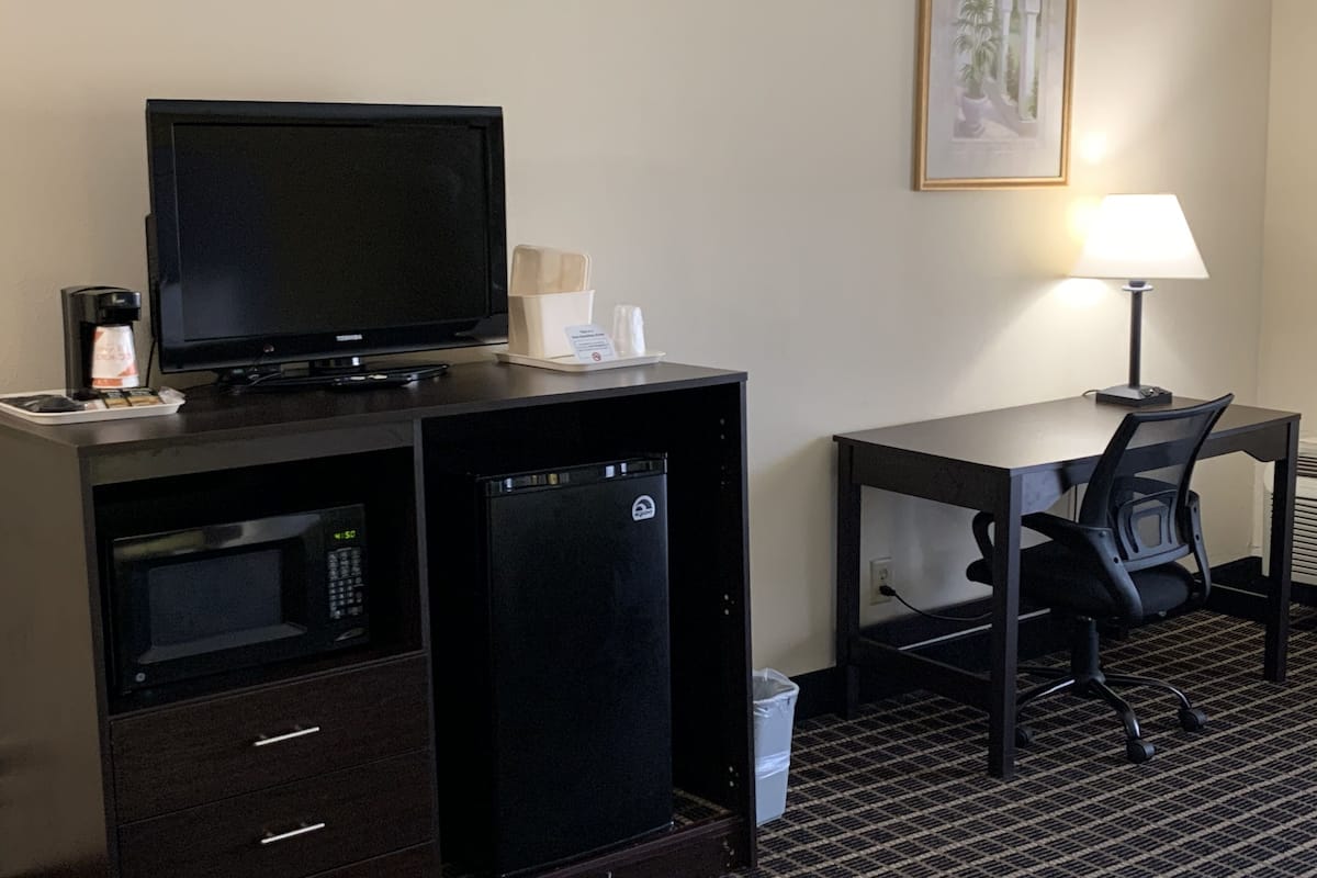 desk, blackout curtains, iron/ironing board, free cots/infant beds