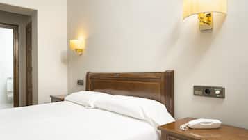 Ropa de cama de alta calidad, minibar, caja fuerte y escritorio
