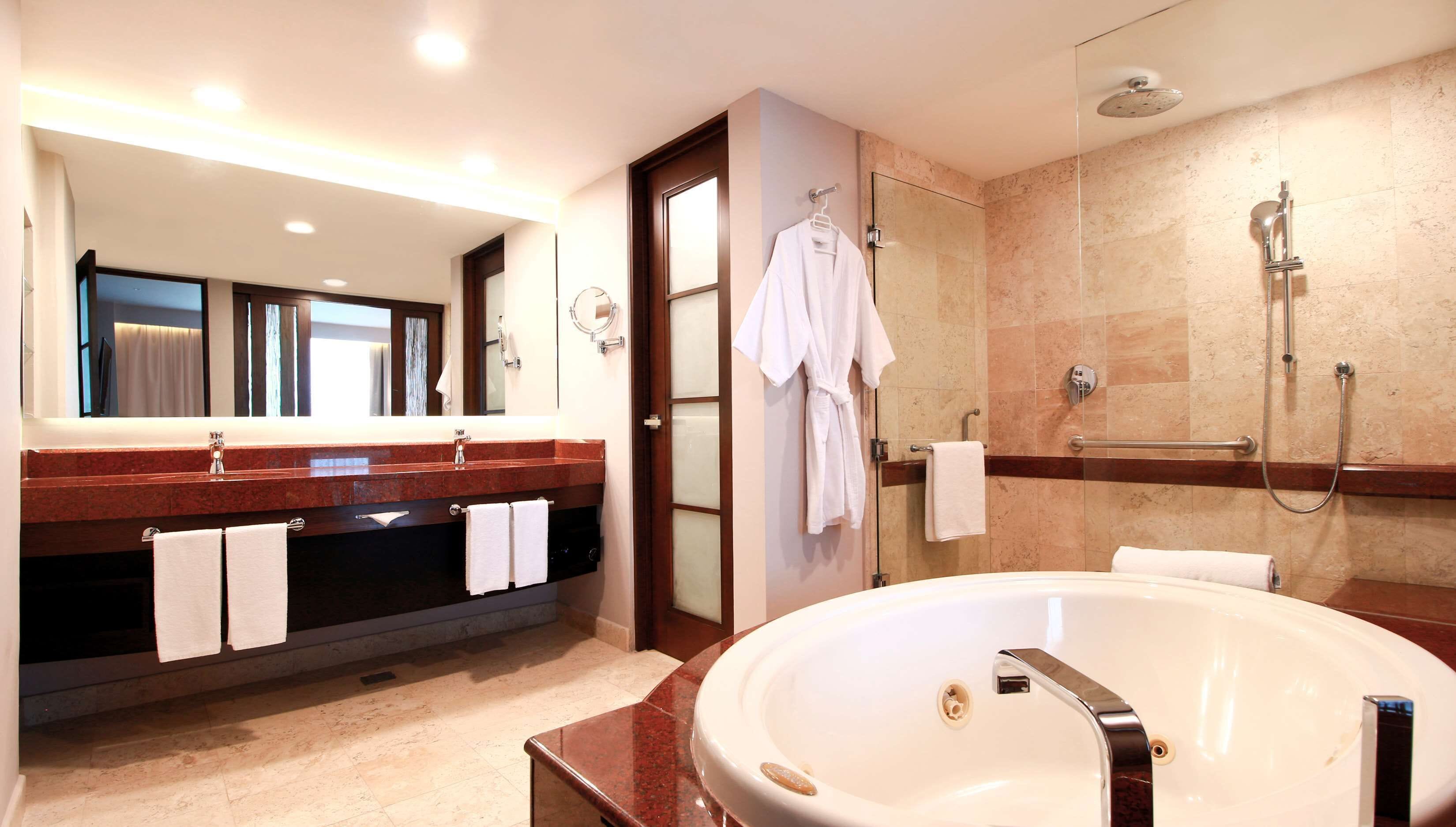 suite, 1 king bed with sofa bed | bathroom | shower, rainfall showerhead, hair dryer, bathrobes