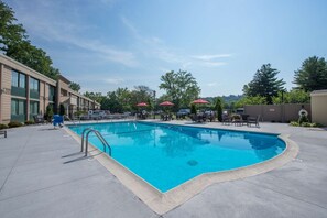 Seasonal outdoor pool, open 11:00 AM to 8:00 PM, sun loungers