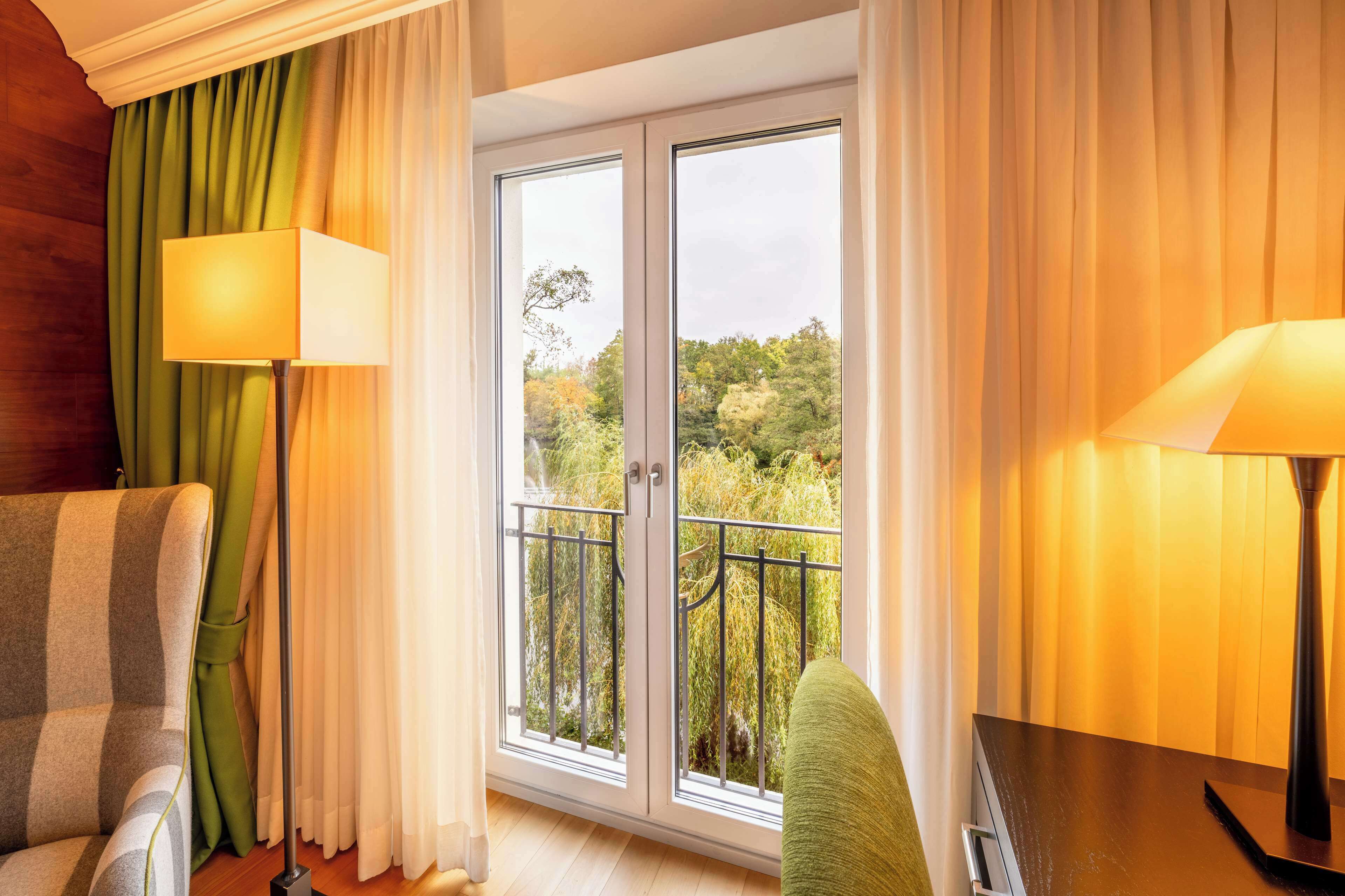 executive room, 2 single beds, lake view | living area | 80-inch flat-screen tv with satellite channels, tv, toys