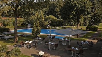 Indoor pool, seasonal outdoor pool, pool umbrellas, pool loungers