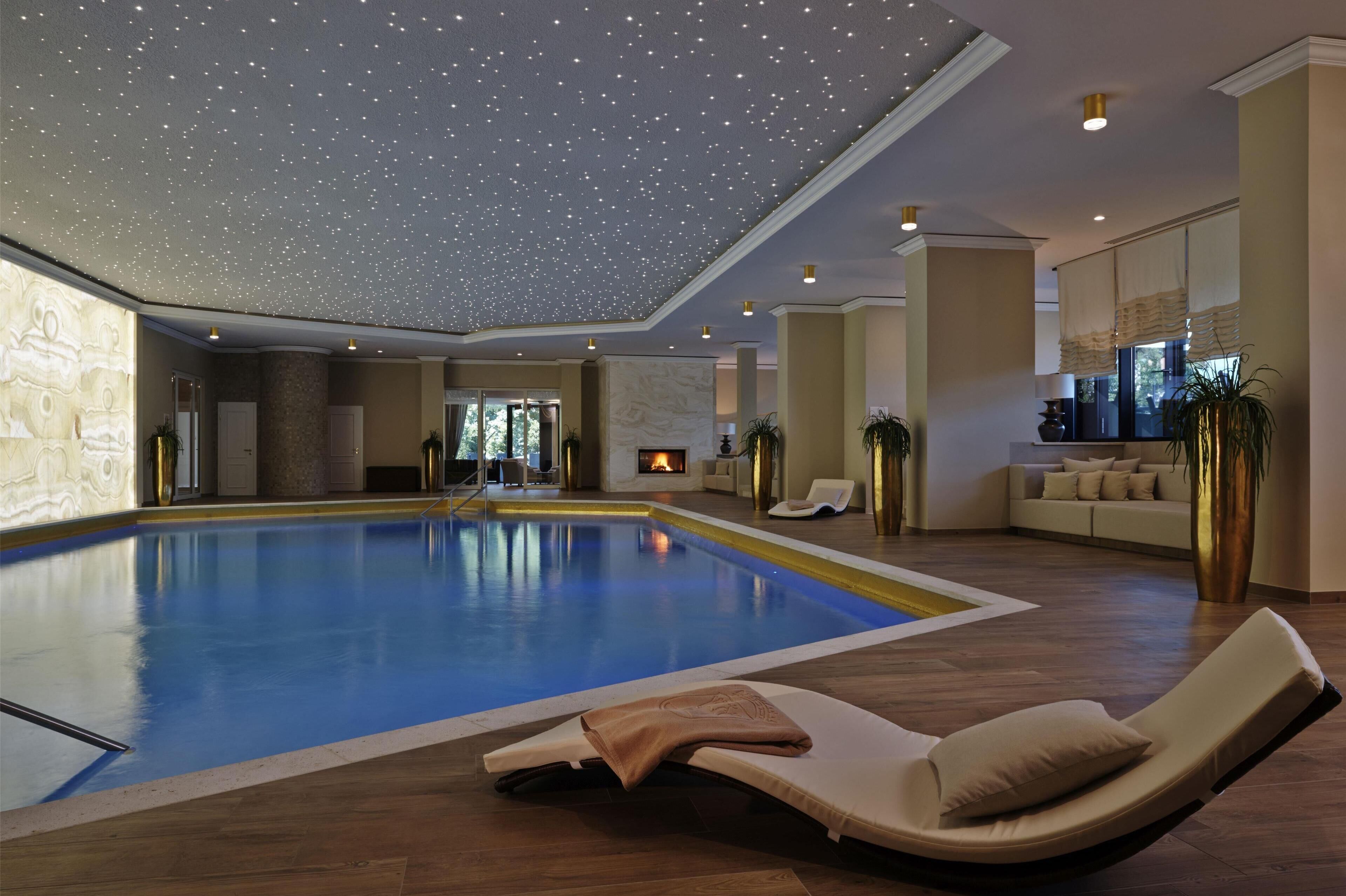 Indoor pool, seasonal outdoor pool, pool umbrellas, pool loungers