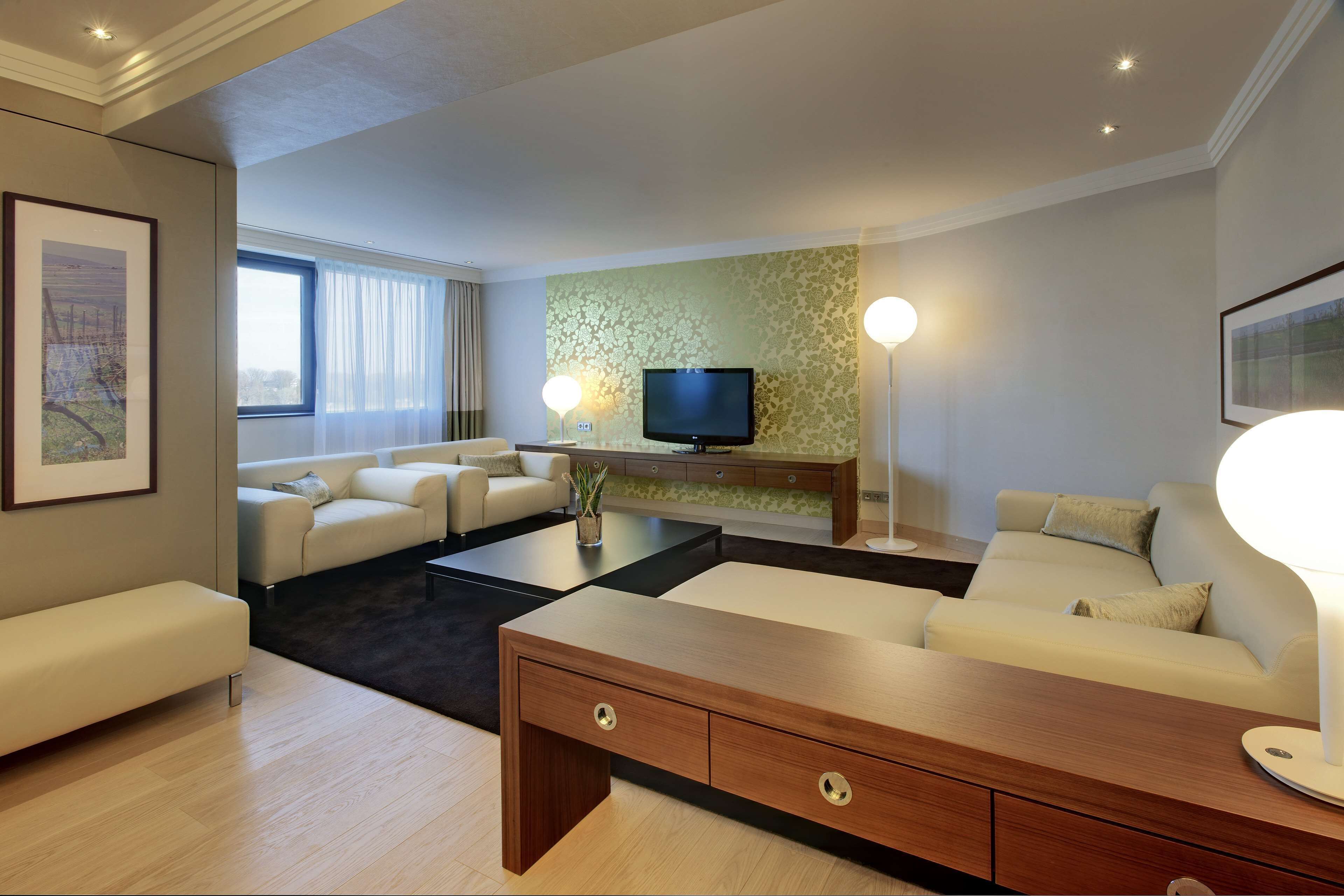 presidential suite | living area | 37-inch flat-screen tv with satellite channels, tv, mp3 dock