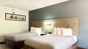 Premium bedding, desk, laptop workspace, blackout drapes
