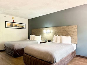 Premium bedding, desk, laptop workspace, blackout drapes