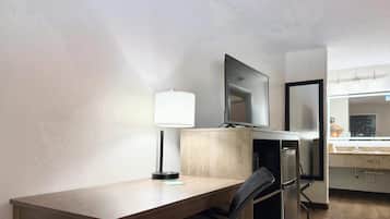 Premium bedding, desk, laptop workspace, blackout curtains