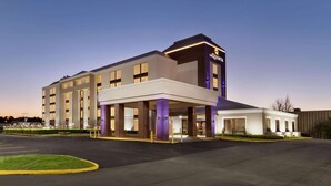 A hotel with a modern design, featuring a prominent 'QUINTA' sign, multiple floors, and a covered entrance area. - La Quinta Inn & Suites by Wyndham Dothan (Dothan)