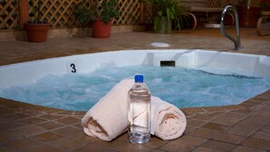 A hot tub with a towel and a water bottle. - The Christie Lodge - All Suite Property, Vail Valley/Beaver Creek (Avon)