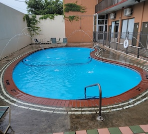 Seasonal outdoor pool, open 8:00 AM to 8:00 PM, pool loungers