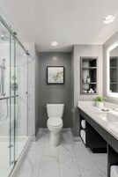 Shower, designer toiletries, hair dryer, bathrobes