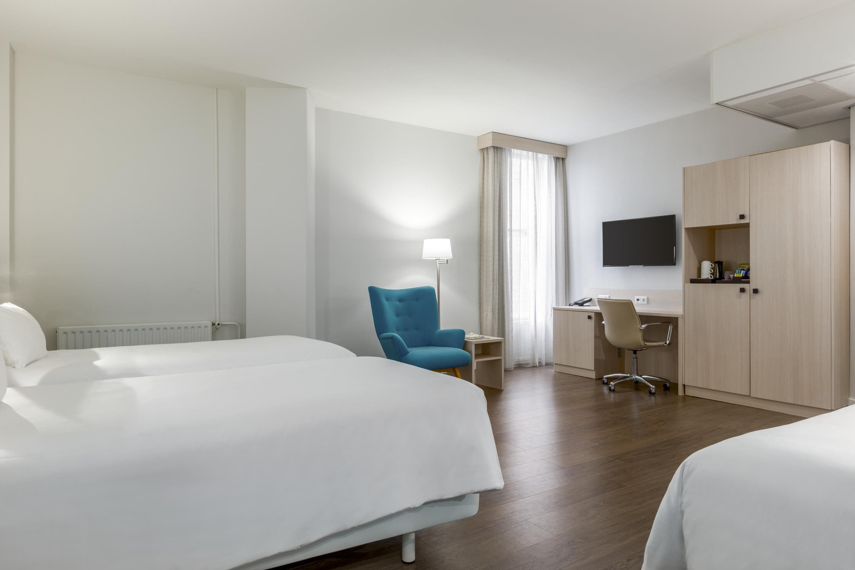 Standard Triple Room, City View | Minibar, in-room safe, blackout drapes, soundproofing