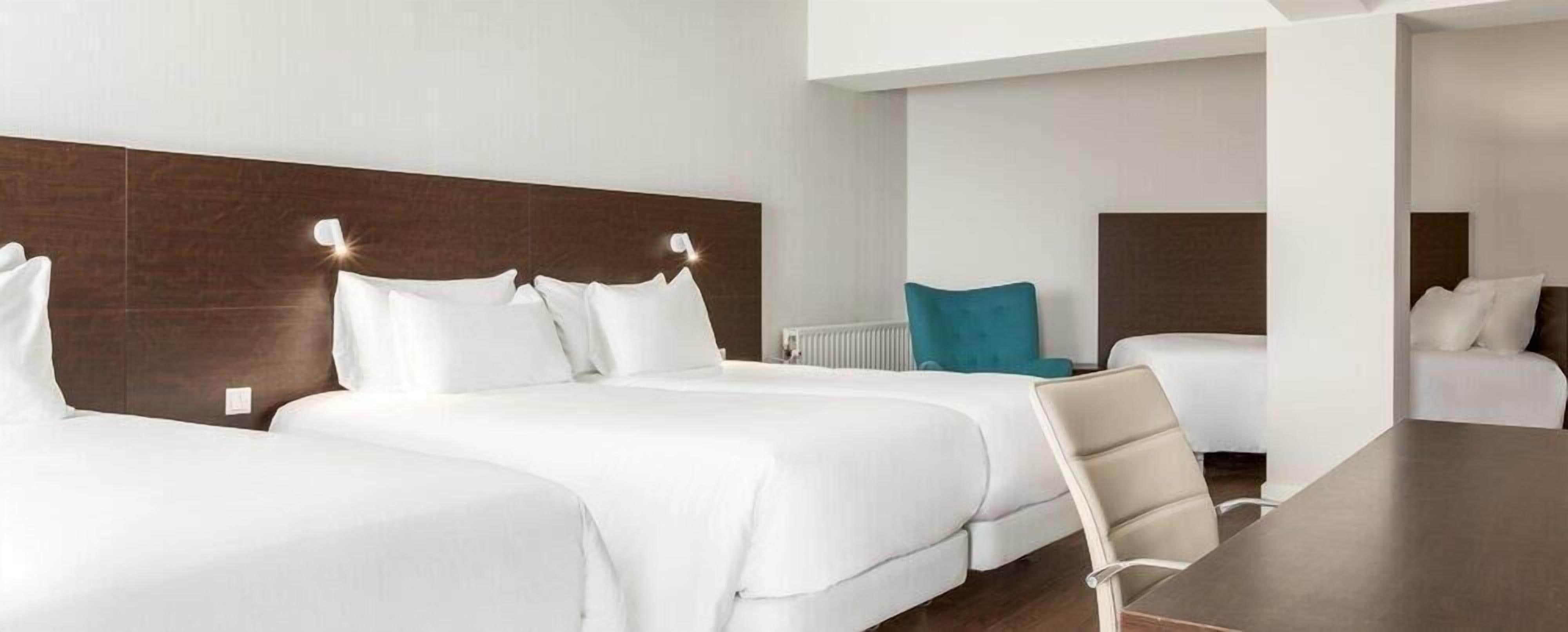 Family Quadruple Room (New Style, 3 Adults + 1 Child) | Minibar, in-room safe, blackout drapes, soundproofing