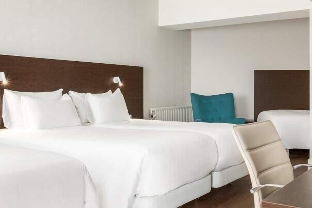 Family Quadruple Room (New Style, 3 Adults + 1 Child) | Minibar, in-room safe, blackout drapes, soundproofing